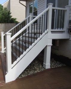 a white railing on the side of a house