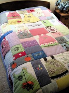 a bed with a colorful quilt on top of it