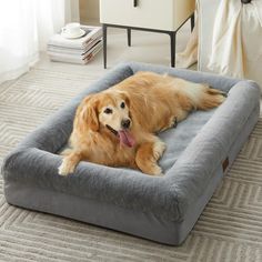 a golden retriever laying on top of a dog bed