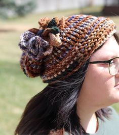 "Variegated Crochet Beanie  One-of-a-kind (Light/Dark Brown, Beige, Burgundy, Royal blue, Light Blue, Olive/Dark Green) Diameter 9.5\", 12\" Deep, 13\" Tall. The crochet flower with Button is removable with pin." Crochet Hats For Fall, One Size, Crochet Hat For Fall, Bohemian Knitted Hat For Fall, Crochet Fall Hat One Size, Hand Knitted One Size Yarn Hats, Bohemian Knitted Fall Hat, Bohemian Knitted Hat, One Size Fits Most, Bohemian Knit Hats For Fall, Hand Knitted Yarn Hats One Size Fits Most