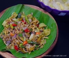 a plate with noodles and vegetables on it next to a purple bowl filled with rice