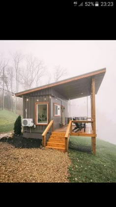 a small house with stairs leading up to it