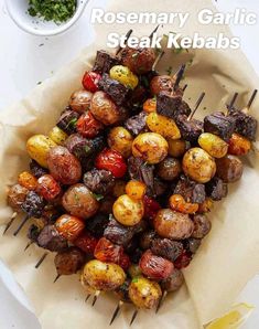 grilled vegetables on skewers with lemon wedges