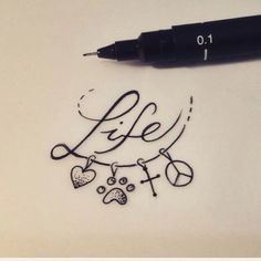 a pen is laying on top of a piece of paper with the word life written in cursive writing