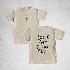 Look Mom I Can Fly Shirt, Cactus Jack Tee, Travis Scott Cactus Jack T-shirt, Cactus Jack Merch, Travis Scott Cactus Jack Tee, Unisex Tee This classic unisex jersey short sleeve tee fits like a well-loved favorite. Soft cotton and quality print make users fall in love with it over and over again. These t-shirts have-ribbed knit collars to bolster shaping. The shoulders are tapered for a better fit over time. Dual side seams hold the garment's shape for longer.  .: Made with 100% Airlume combed and ring-spun cotton, a lightweight fabric (4.2 oz/yd² (142 g/m that is easy to layer, breathable. Perfect for active and leisure wear.  .: The retail fit that is perfect for casual and semi-formal settings. The crew neckline adds a classic, neat style that's perfect for accessorizing. .: Bella+Canvas Cactus Jack Brown Shirt, Casual Cotton Shirt With Front And Back Print, Cotton Relaxed Fit Shirt With Front And Back Print, Cotton Shirt With Front And Back Print, Relaxed Fit, Travis Scott Merch, Travis Scott Cactus Jack, Cactus Jack, Travis Scott, Leisure Wear