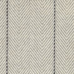 an upholstered fabric with black and white herringbones on the bottom half