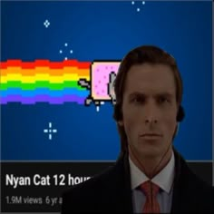 a man in a suit and tie is looking at a computer screen with a rainbow pixel on it