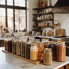 jars filled with food sit on a counter in a kitchen