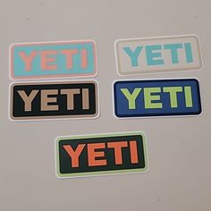 four stickers with the words yeti, yeti and yeti on them