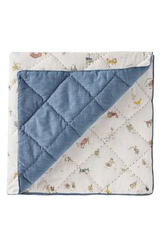 a blue and white quilted baby blanket with animals on it's side,