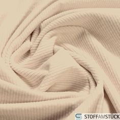 an image of a white fabric that is very close to the camera and looks like it has been folded up