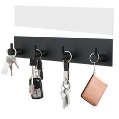 a key holder with keys hanging from it's hooks and two wallets attached to them