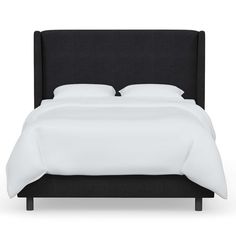 a bed with white linens and pillows on top of it, against a white background