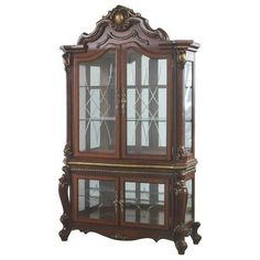 an old fashioned china cabinet with glass doors