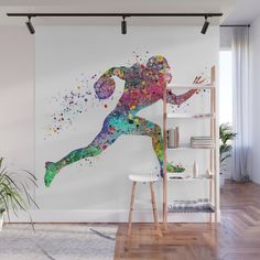 a woman running with colorful paint splatters on her body wall mural decal