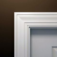 an open white frame on a brown wall