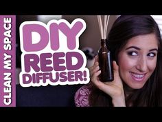 a woman holding up a bottle with reed diffusers in it's hand and the words diy red diffuser above her head