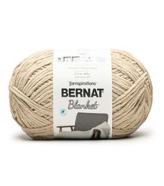 a ball of yarn with the label bernat blaukraed in white and black