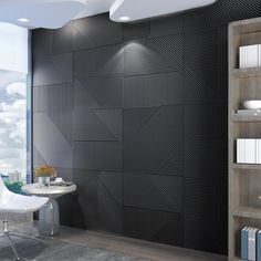 a modern bathroom with black and white tiles on the wall, along with bookshelves