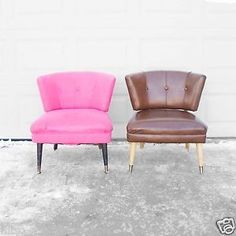 two pink and brown chairs sitting next to each other