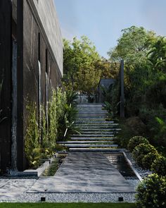 a set of stairs leading up to the top of a building with trees and bushes on either side