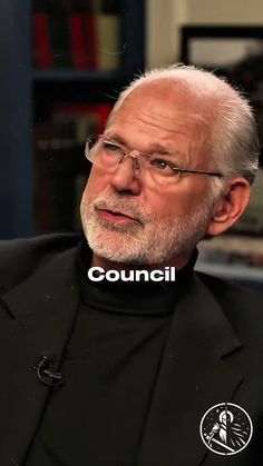 an older man wearing glasses and a black shirt with the words council over his face