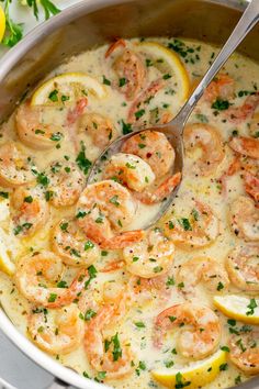 a pot filled with shrimp and lemon sauce