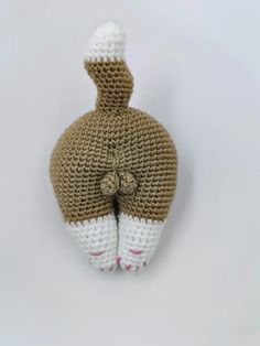 a crocheted stuffed animal is shown in the shape of a bottle with its mouth open