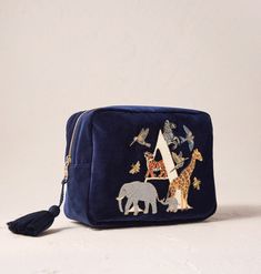 Featuring an elegant zip tassel, handy inner pockets, and a waterproof lining, this Wash Bag is a must-have for any skincare guru, perfect for keeping your products organised while travelling or looking pretty on your bathroom shelf. Green Bay Packers Shirts, Illustrated Gift, Gold Bee, Elegant Makeup, Christmas Gift Shop, Bathroom Shelf, Navy Velvet