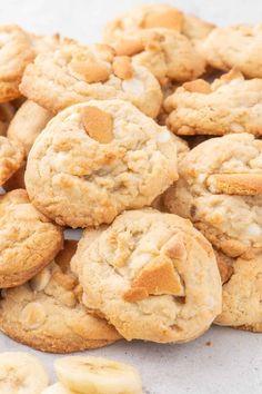 some cookies and bananas are on a table