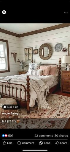 a bed room with a neatly made bed and lots of pictures hanging on the wall