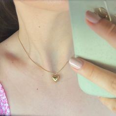 "Puffed Mini Heart Necklace in Gold ✨ Fully stainless steel & tarnish proof! (18k gold plated) 16\" with a 2\" extender  Snake chain style featuring a mini gold puffed heart pendant 🤍 Handmade with love!" Gold Heart Necklace With Box Chain, Gold Heart Pendant Necklace With Box Chain, Gold Plated Heart Necklace With Gold Chain For Gift, Yellow Gold Heart Necklace With Gold Chain, Gold Heart Necklace As Gift, Gold Heart Shaped Box Chain Jewelry, Heart-shaped Gold Chain Necklace For Gift, Heart Shaped Gold Chain Necklace For Gift, Gold Jewelry With Heart Charm And Snake Chain