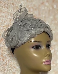 Gray and Silver Fascinator Half Hat for Church, Tea Party, Weddings, and Special Occasions. Millinery hat braid, bead trim and crinoline/horse hair and hat pin. Red Head covering for church and headwear. The hat measures 10X7 inches SHIPPING All items for free shipping will be shipped via USPS FIRST CLASS MAIL. Gifts for mom, sister, wife, or yourself. Elegant Adjustable Bonnet For Church, Elegant Fitted Costume Hats And Headpieces For Celebration, Elegant Adjustable Fascinator For Celebrations, Elegant Fitted Costume Hats For Celebration, Summer Wedding Adjustable Headwrap, Elegant Adjustable Mini Hat For Celebrations, Adjustable Hats For Kentucky Derby Celebration, Elegant Fitted Fascinator For Celebration, Adjustable Silver Costume Hats For Evening