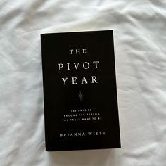 the pivot year book laying on top of a bed