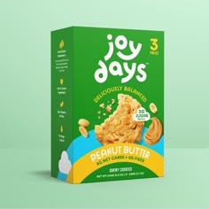 a box of joy days peanut butter crunchies on a green and blue background with the words joy days written in white