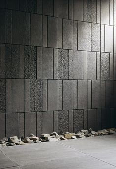 a black and white photo of a room with rocks on the floor