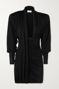 Drapery has become something of a signature for Anthony Vaccarello - combined with powerful SAINT LAURENT silhouettes, the results are nothing short of striking. This mini dress is made from black wool-jersey that's fluid through each fold. The padded, boxy shoulders contrast the plunging neckline and micro hem. Saint Laurent Black Dress, Ysl Dress Short, Vintage Ysl Dress, Ysl Clothes, Deadly Doll, Ysl Dress, Dancesport Dresses, Dream Wishlist, Saint Laurent Dress