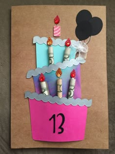 a birthday card made to look like a cupcake with candles on top and number 13