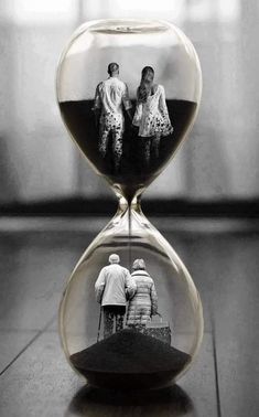 an hourglass with two people in it