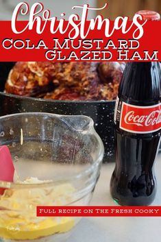 a bottle of coca - cola next to a bowl of food