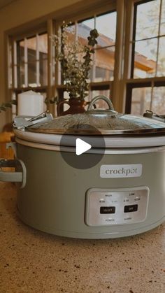 a crock pot sitting on top of a kitchen counter