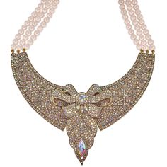 Unveil the mystery and charm of the Regency era with the "Lady Whistledown" Beaded Crystal Bow Necklace, inspired by the enigmatic gossip maven of Bridgerton. This exquisite necklace features a dazzling bow centerpiece, intricately adorned with AB color crystals that shimmer with every subtle movement. Suspended from a delicate triple strand of light rose mink-colored beads, this piece combines elegance with a whisper of intrigue. Crafted for the modern-day lady who delights in the blend of soph Bow Centerpiece, Lady Whistledown, Heidi Daus, Regency Era, Bow Necklace, Light Rose, Rose Lights, The Lady, Color Crystal