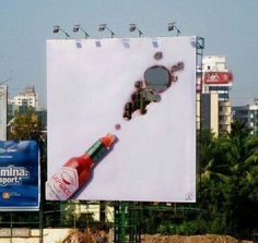 a billboard with a bottle of beer on it