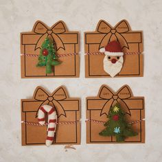 four pieces of cardboard with christmas decorations on them