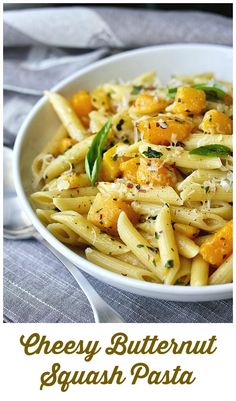 a bowl filled with pasta covered in cheese