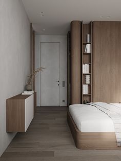 a bed sitting in a bedroom next to a wooden book shelf on top of a hard wood floor