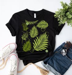 MY SPARE TIME SHIRTAbstract Blue Palm Leaf Summer  Beach Time Shirt,Tropical Leaf Print tshirt,Tropical Vibes Summer Party shirt,Birthday gift Idea ,Easy Simple minimalistic Graphic Design. Our Unisex T-shirts are High Quality, SUPER soft and SUPER comfy. We use BELLA+CANVAS for our T-shirts!Solid colors are 4.2 oz 100% ringspun cotton and heather colors are 52/48 Airlume combed and ringspun cotton/polyester. Unisex sizing Our shirts are individually screen printed right here in the USA. All of our products ship through First-Class mail. **Please note that, due to variations amongst computer monitors, actual colors may vary slightly from what appears on your screen. All the physical accessories that you see in the photos are not included. Please feel free to contact us with any issues or q Tropical Tshirts, Tree Tshirt, Anniversary Scrapbook, Tropical Outfit, Travel Tees, Tropical Leaf Print, Vacation Wear, Small Shops, Upcycled Fashion