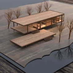 an artistic rendering of a house in the middle of a flooded area with trees around it