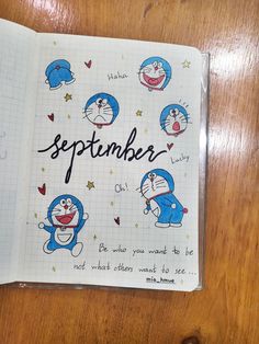 an open notebook with cartoon characters on it and the words september written in cursive writing