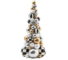 a christmas tree made out of black and white balls with gold trimmings on the top